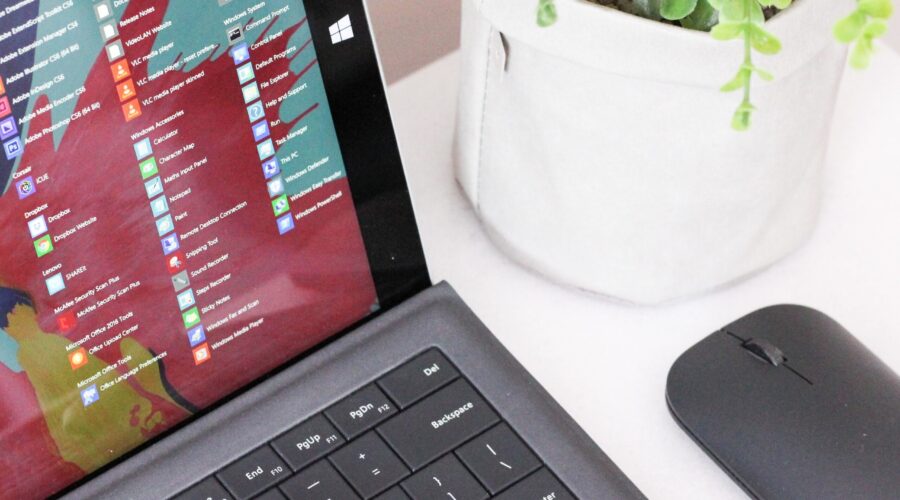 black laptop computer beside black wireless mouse