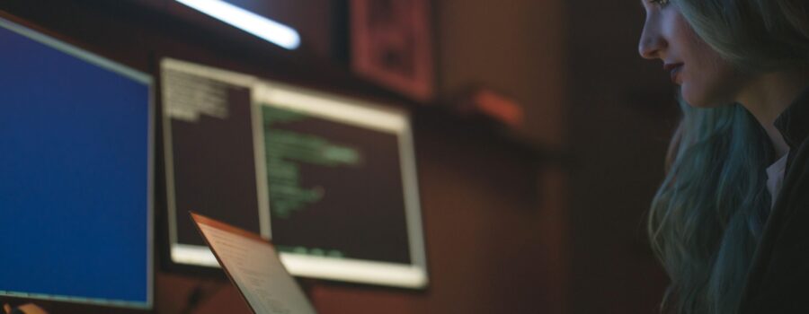 Free Side View of a Woman Using a Laptop Stock Photo