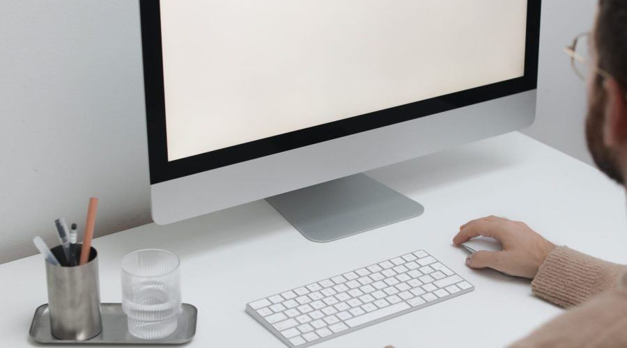 Free Crop man working on computer in workplace Stock Photo