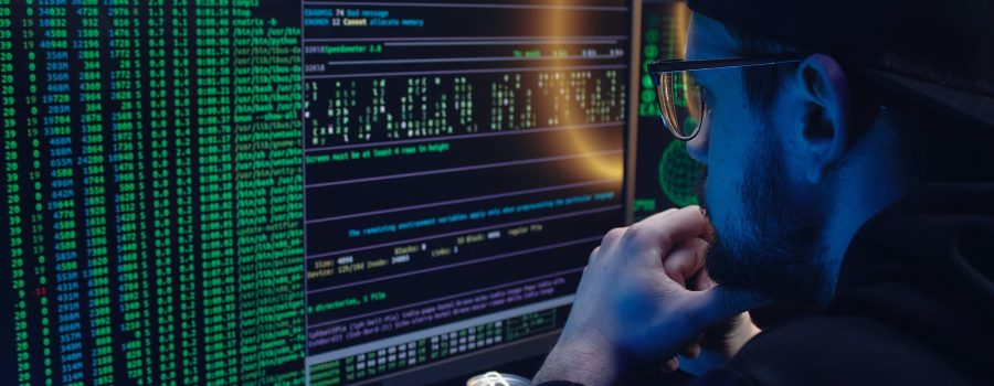Free A Man Looking at a Computer Screen with Data Stock Photo