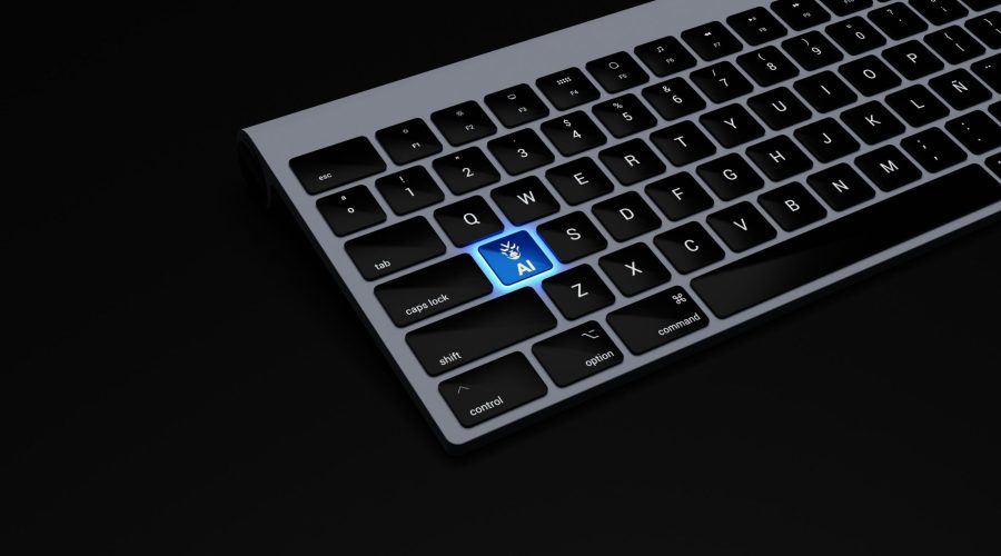 a black keyboard with a blue button on it