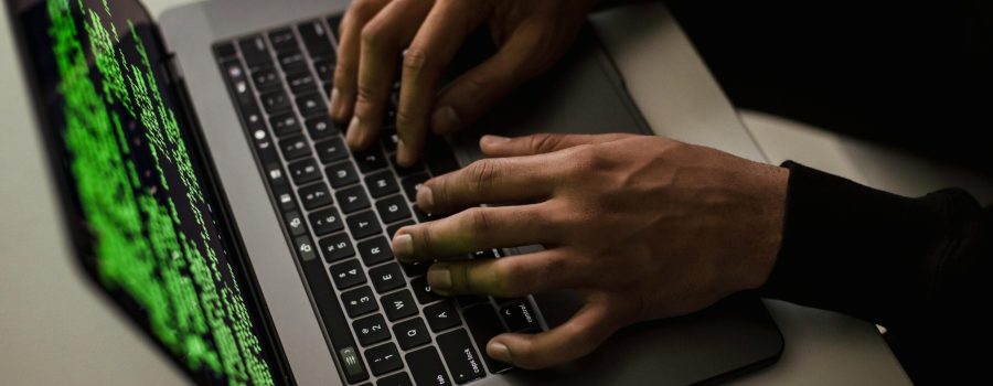 crop-cyber-spy-hacking-system-while-typing-on-laptop