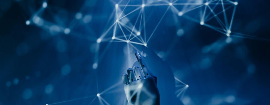 Free A robotic hand reaching into a digital network on a blue background, symbolizing AI technology. Stock Photo