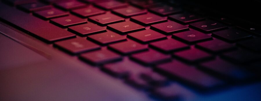 a-close-up-of-a-keyboard-with-a-blurry-background