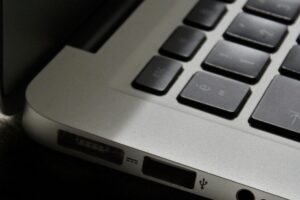 Free Detailed view of a silver laptop showing keyboard and multiple ports. Stock Photo