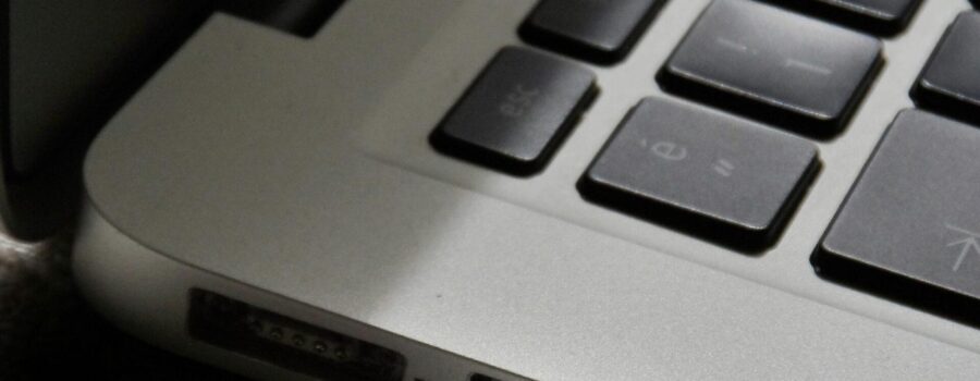 Free Detailed view of a silver laptop showing keyboard and multiple ports. Stock Photo
