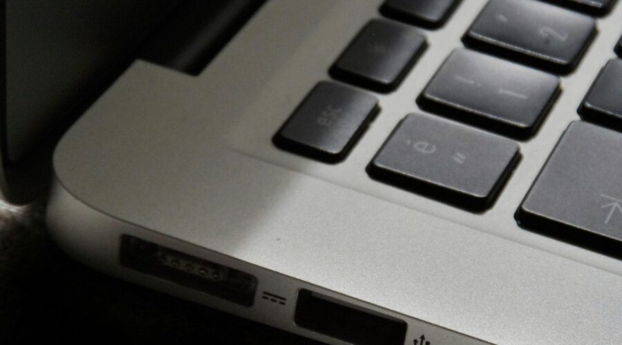 Free Detailed view of a silver laptop showing keyboard and multiple ports. Stock Photo